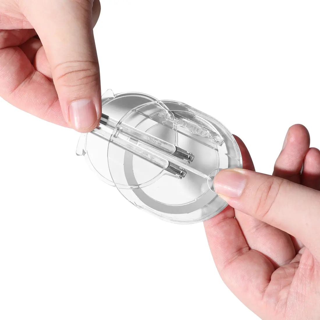 Two hands sliding the folded readers out of the clear case